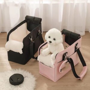 Pink and black soft-sided carrier bags for small dogs